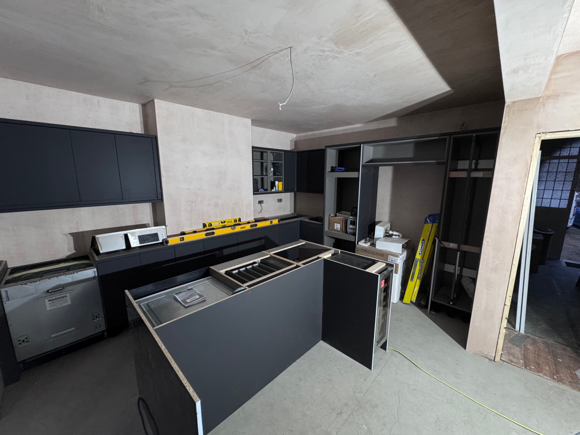 Kitchen units and island under installation
