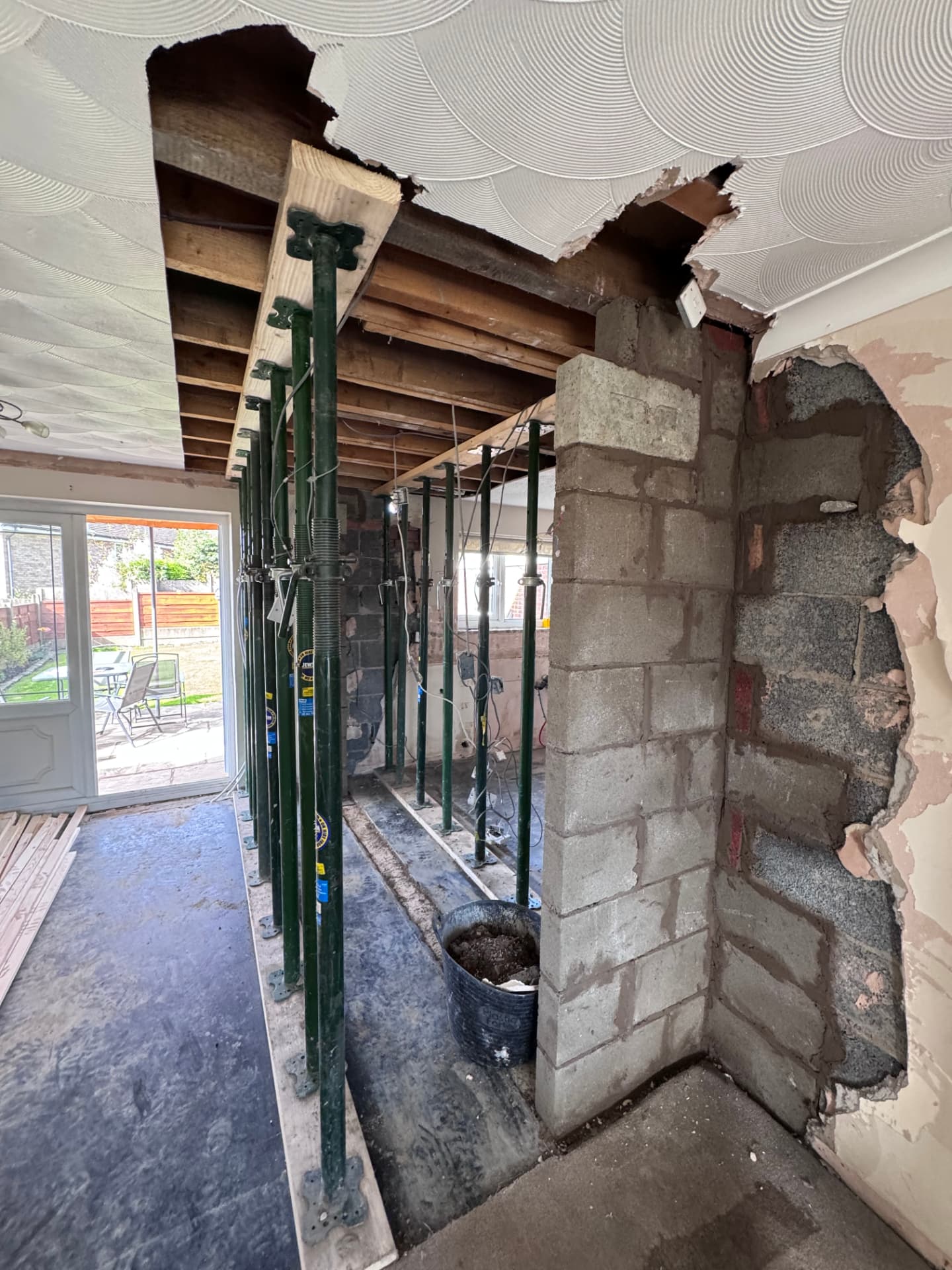 Structural opening propped with new blockwork pier being built