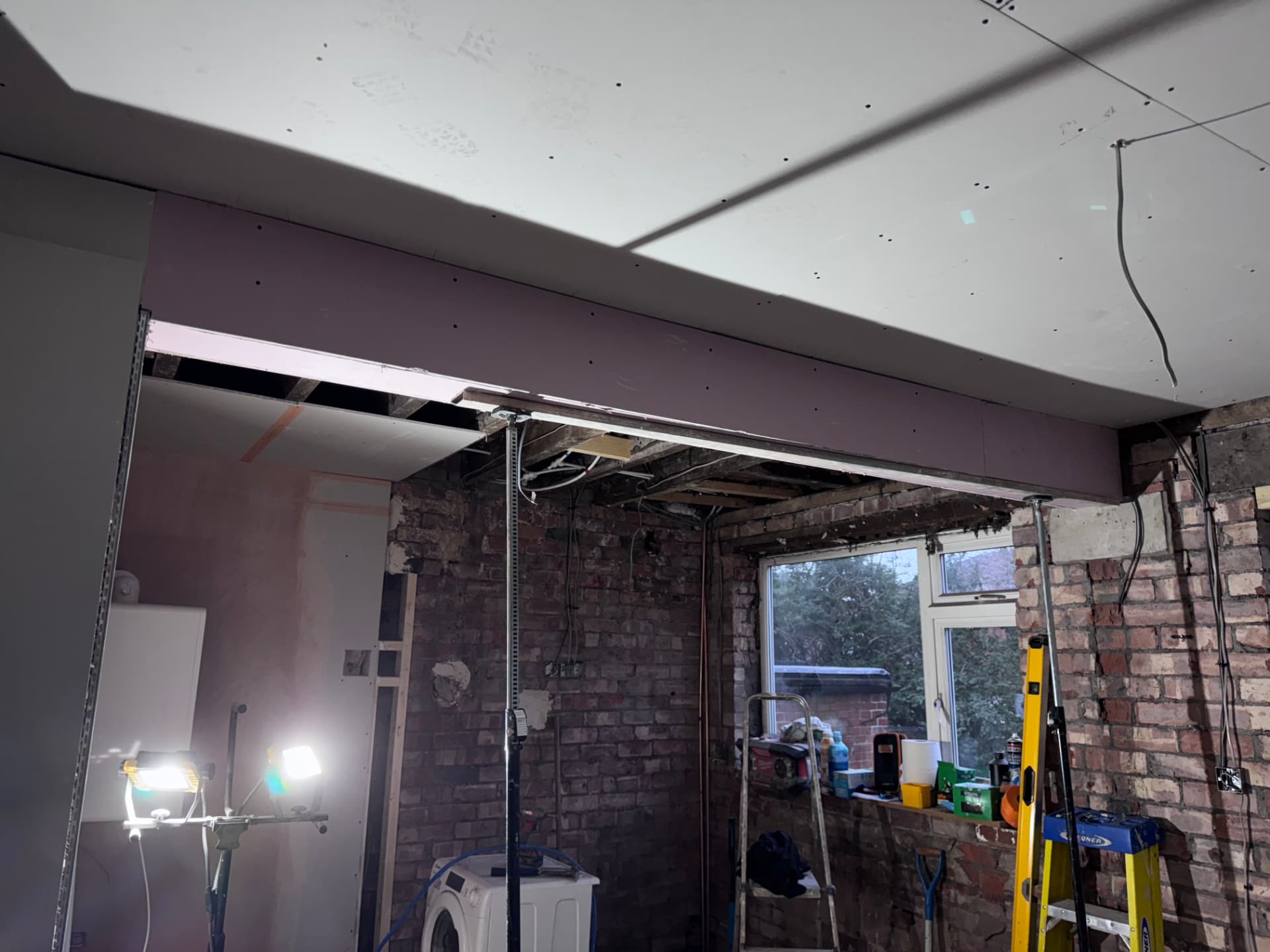 Steel beam boxed in and new ceiling boarded