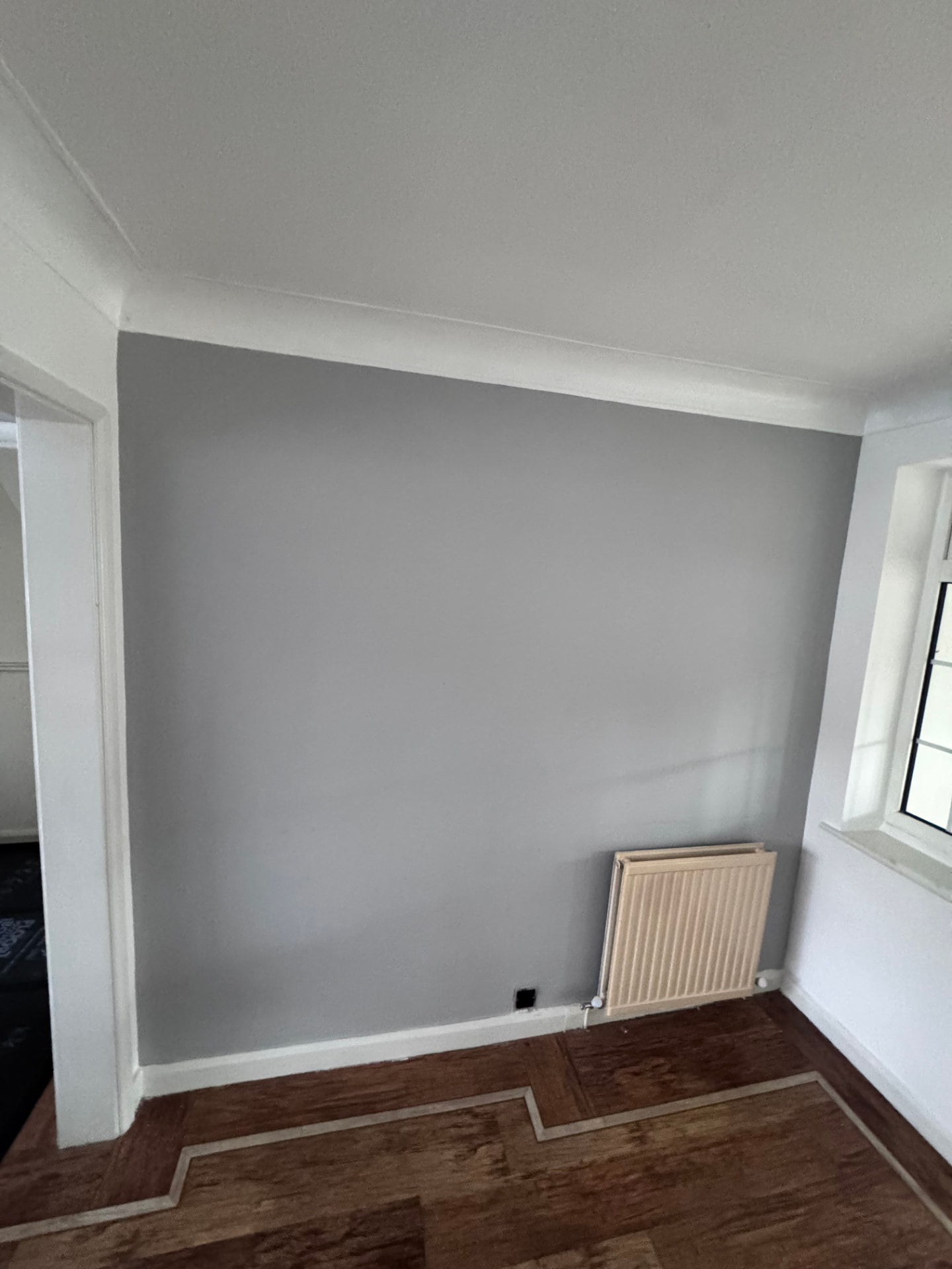 Separated living room decorated and finished after the wall was removed