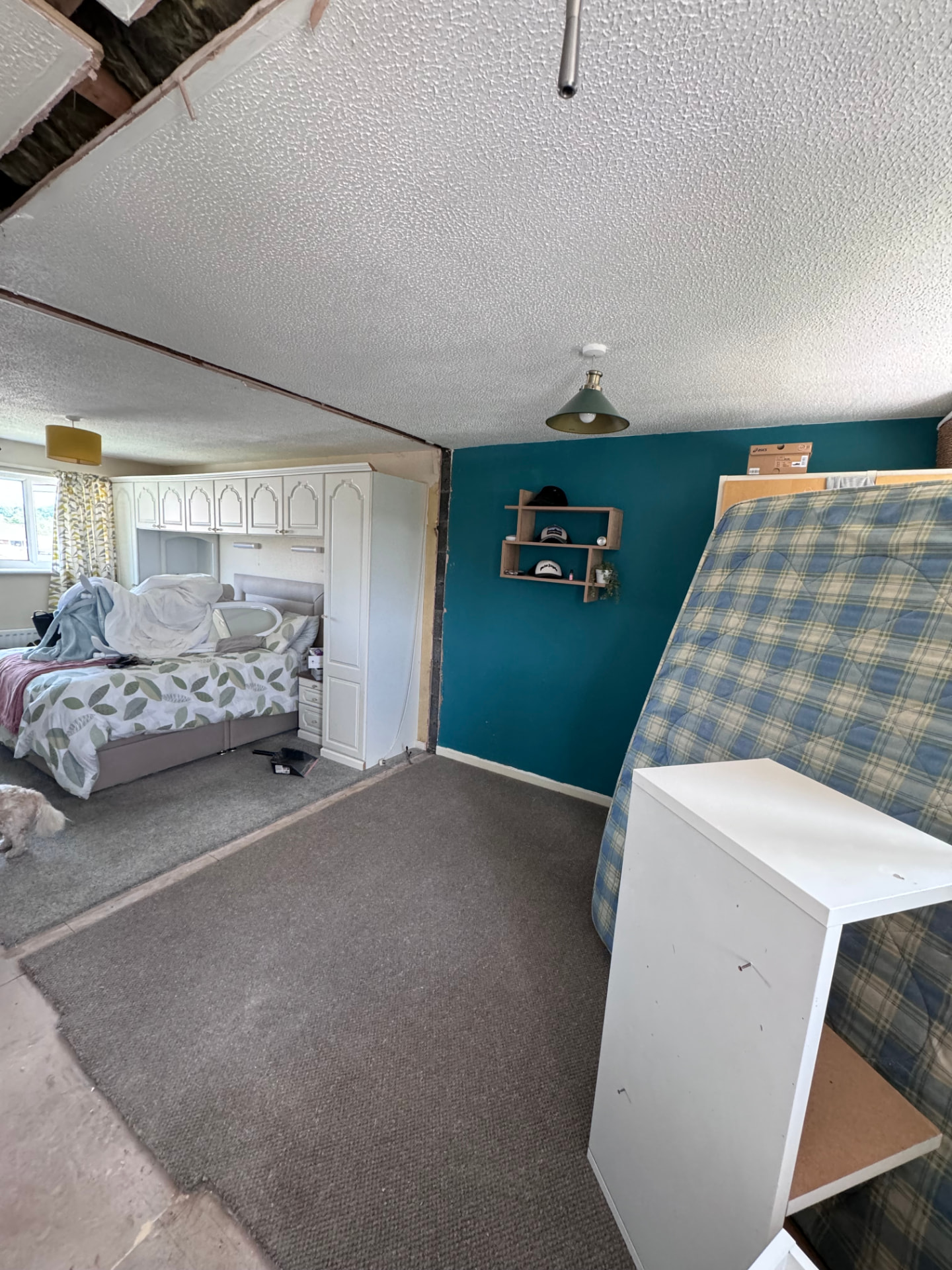 Bedroom wall opened up during the four-to-three bedroom reconfiguration