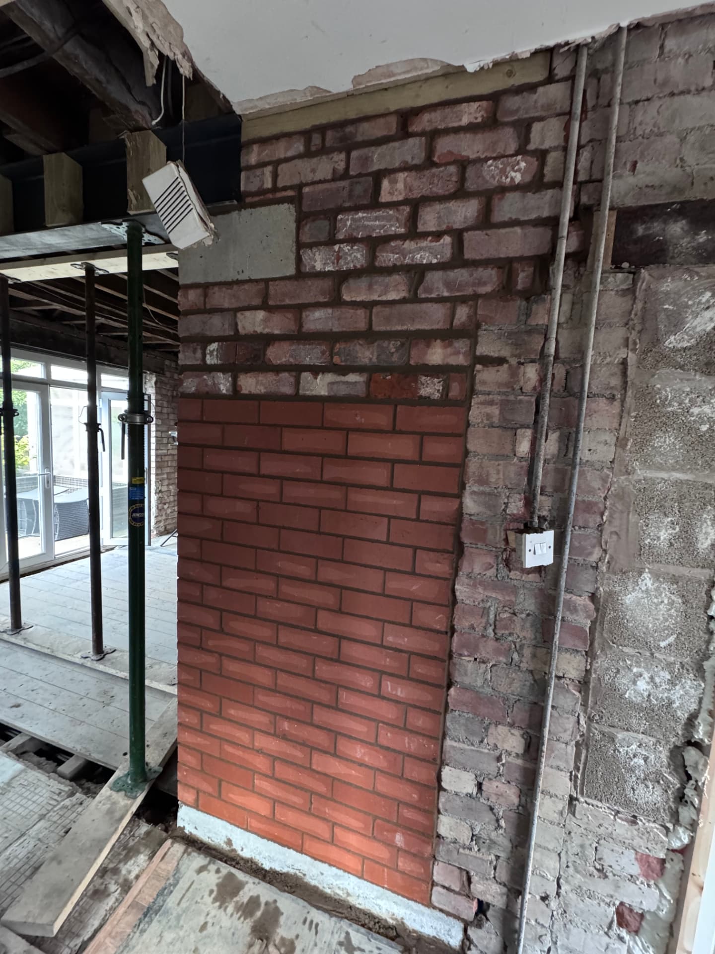New brick pier built up to support the steel