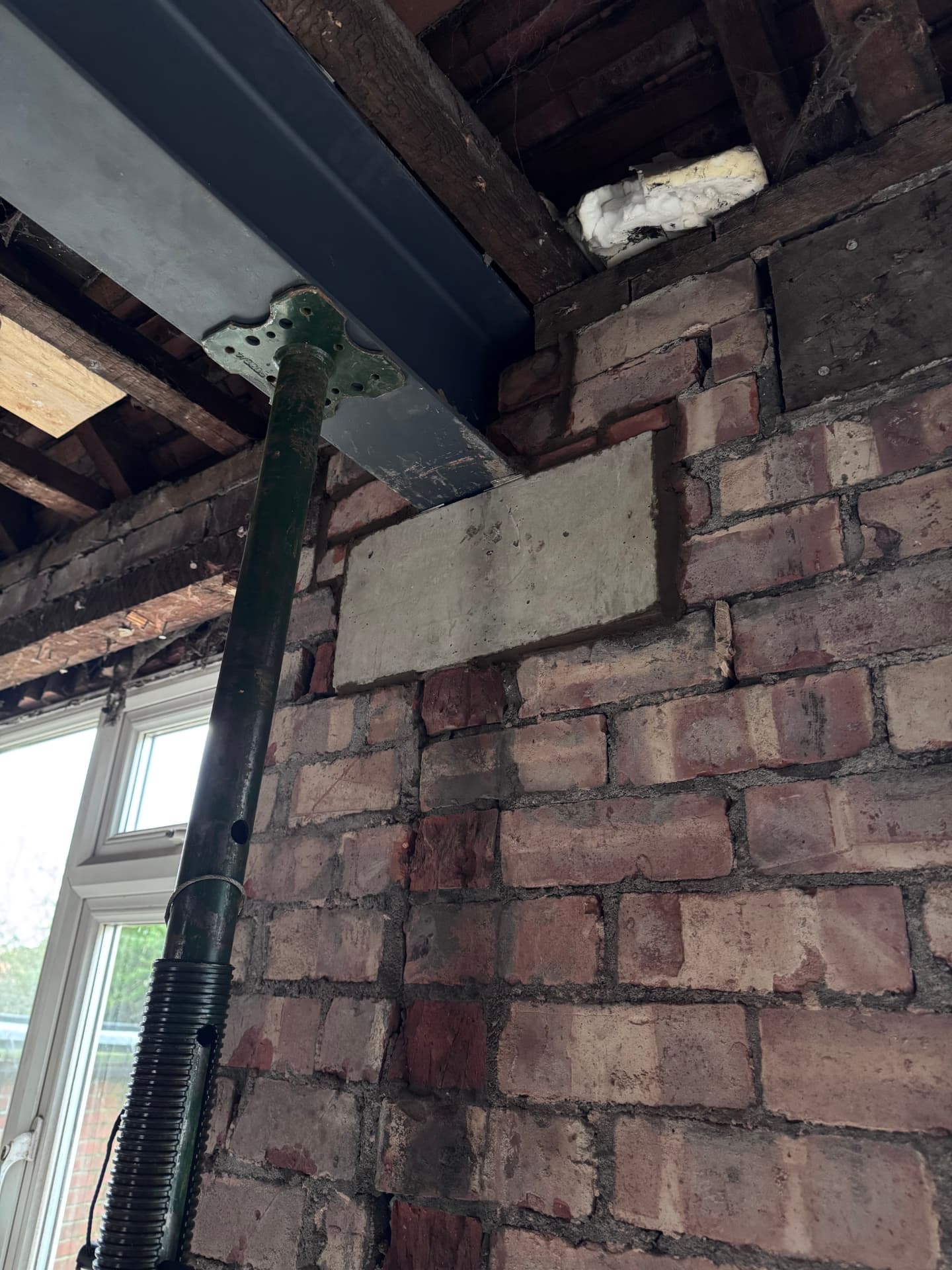 Steel beam bearing onto new concrete padstone