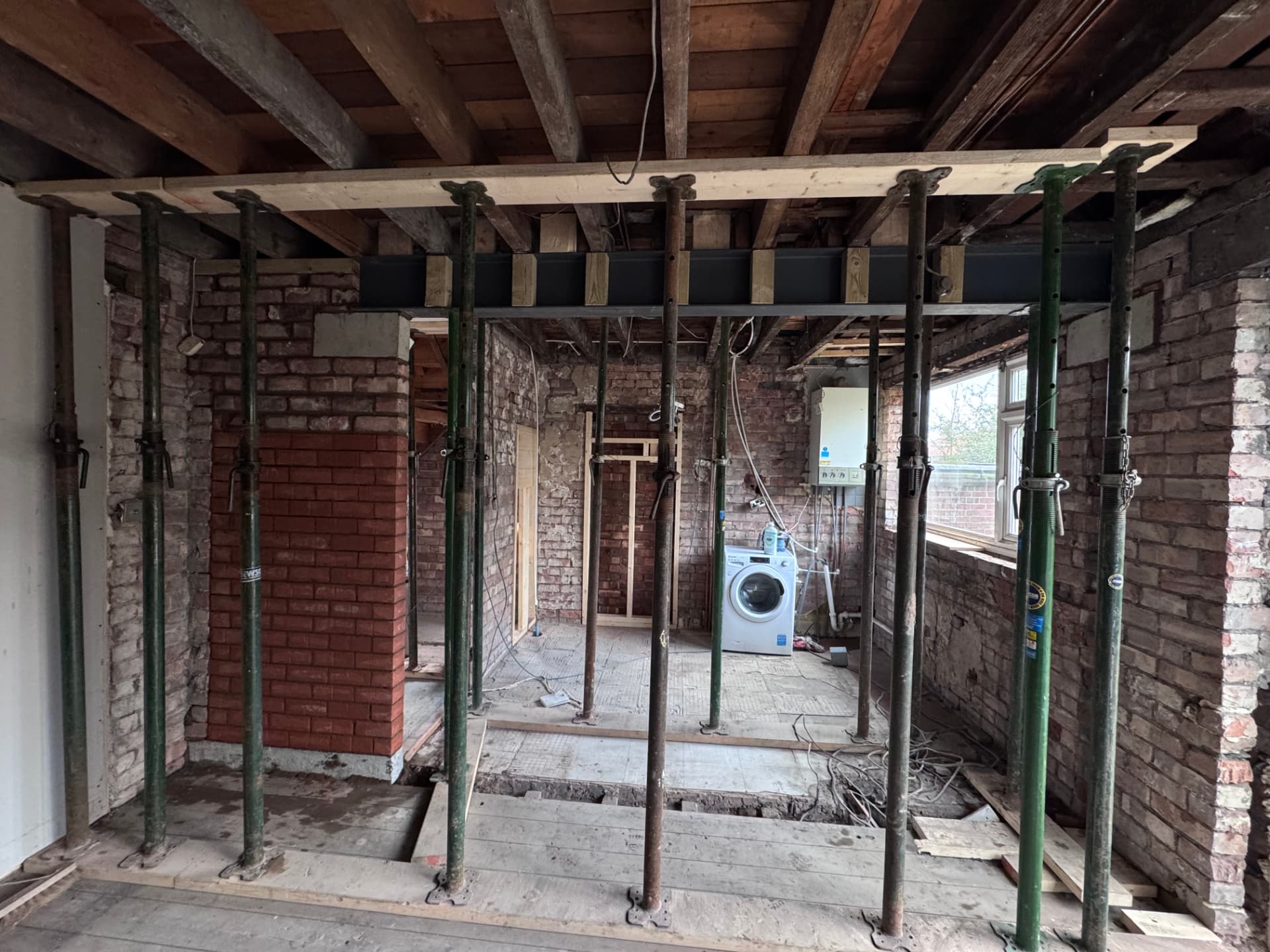 Full span steel beam propped across the open kitchen-diner