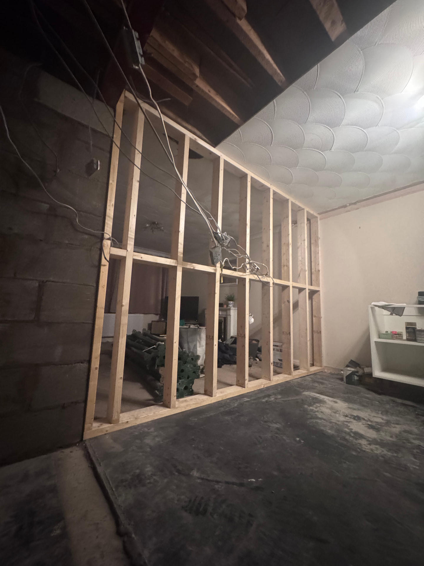 New stud partition framed in the living room during the reconfiguration