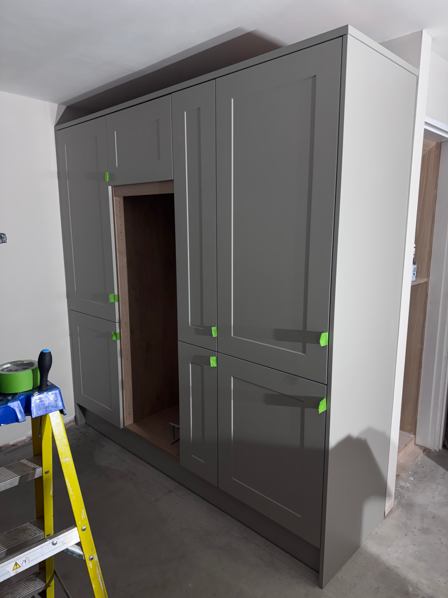 Tall units faced with grey shaker doors during the kitchen fit