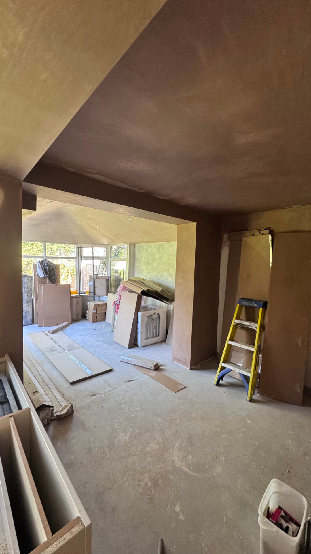 Kitchen-diner fully plastered with the new opening through to the bay window