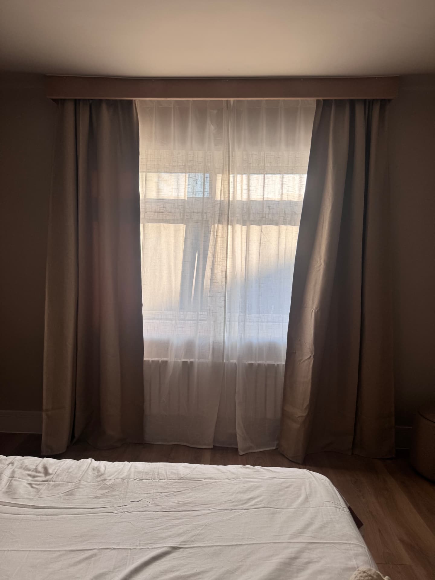 Finished bedroom with new curtains and flooring