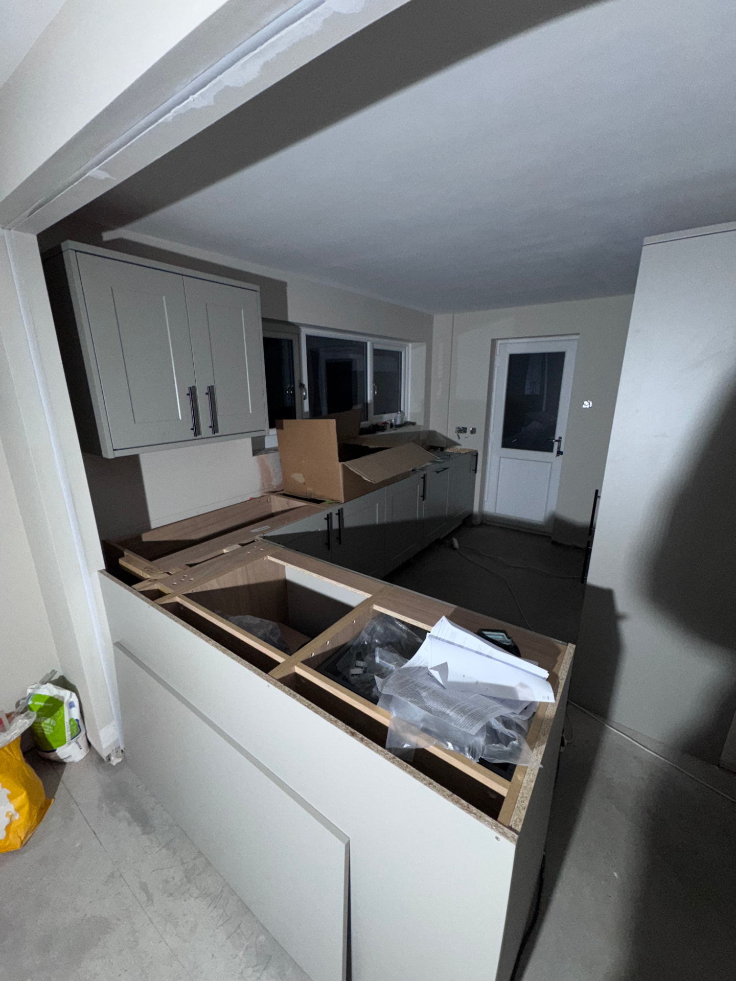 Breakfast bar framed up with worktops being fitted in the new kitchen