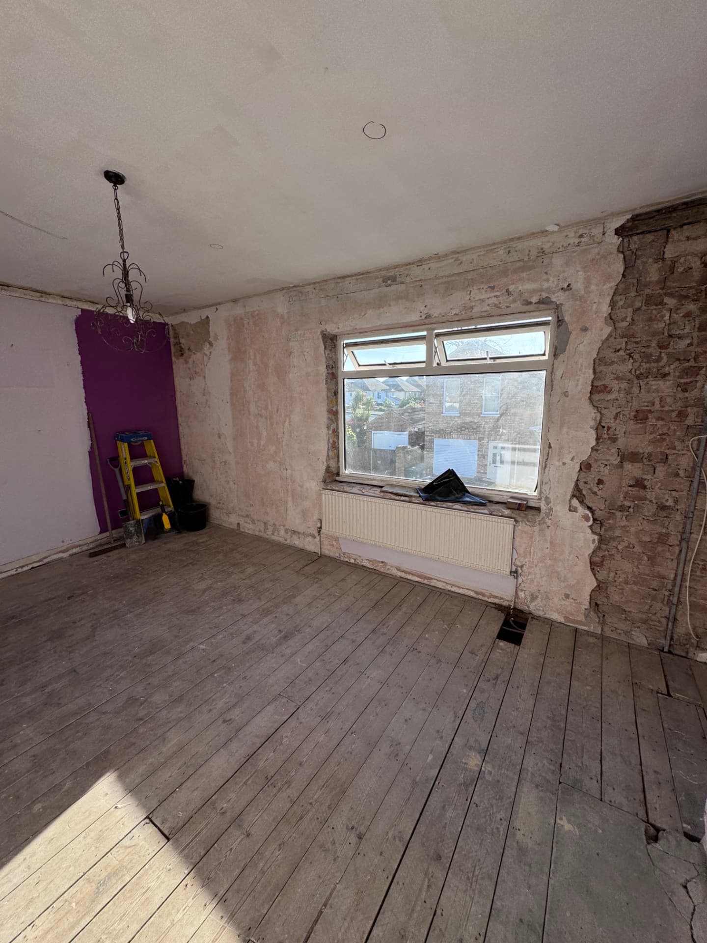 Walls stripped back to brick ready for the rebuild