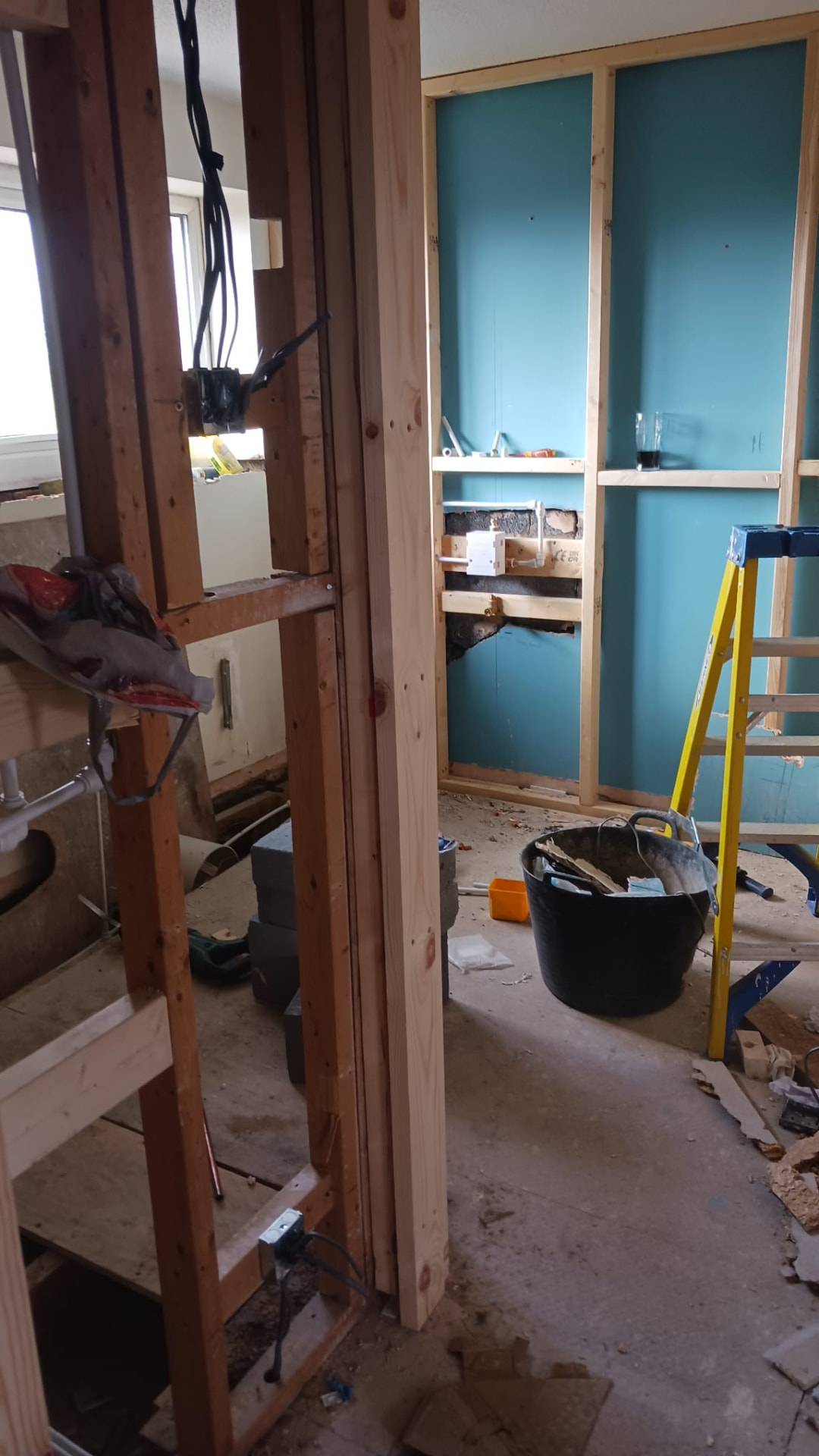 First-fit electrics and plumbing in the stripped-out bathroom