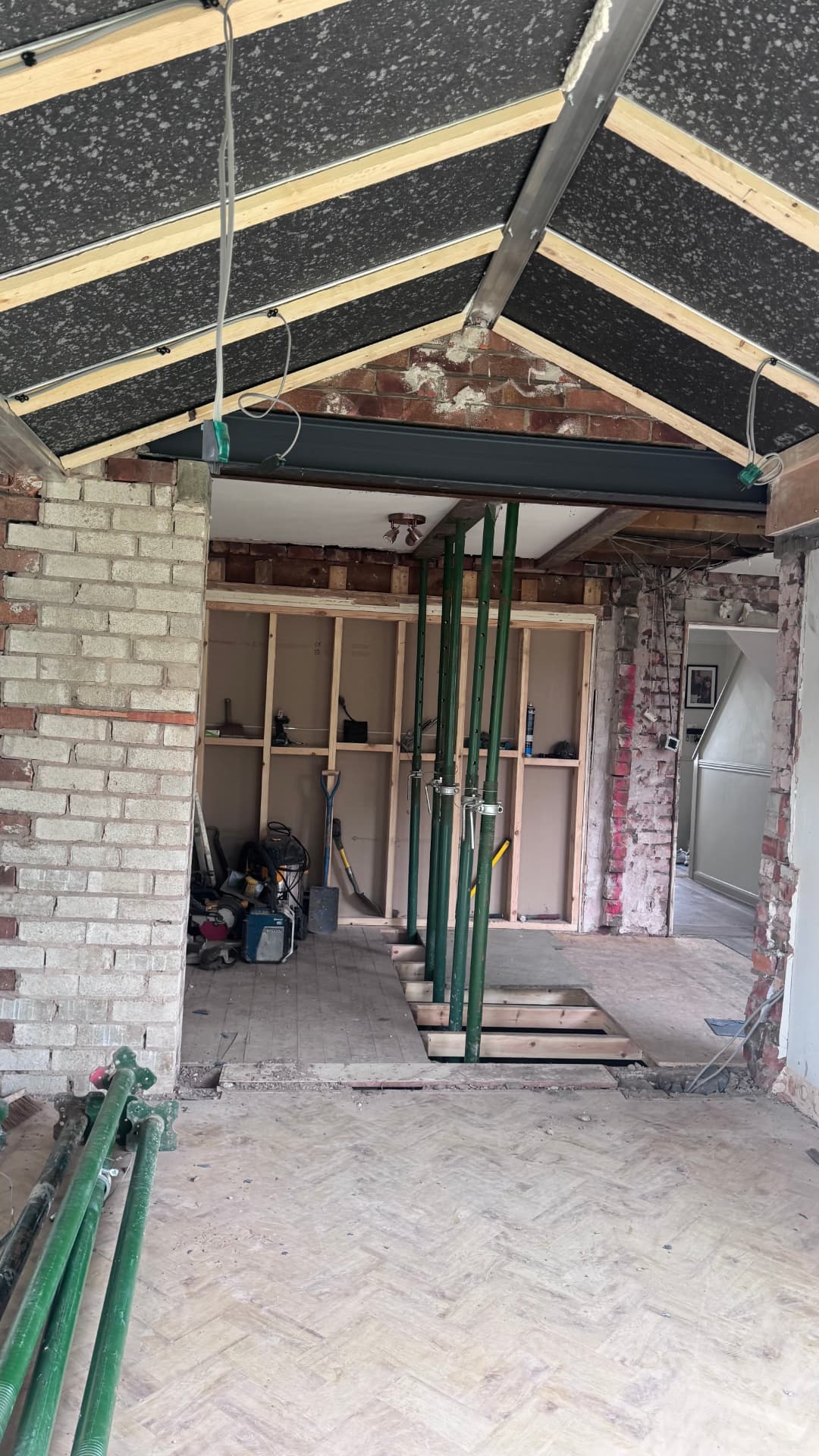 Steel beam fitted with acrow props supporting the structure above
