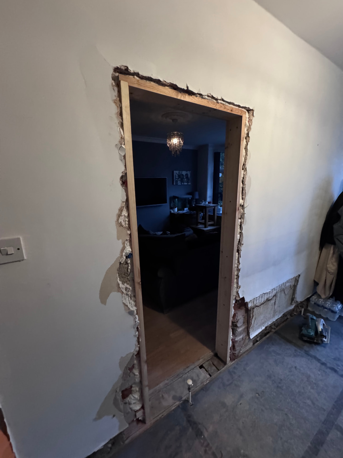 New doorway opening formed between the hallway and lounge